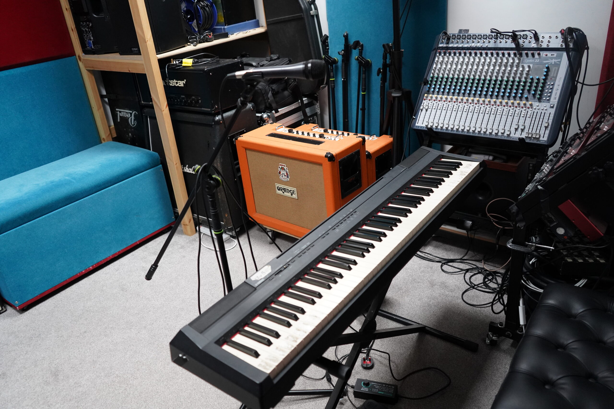 Backline at Harrow Music Studio — Blackstar amp head, Marshall cab, two Orange guitar combos, Soundcraft mixing desk and digital stage piano